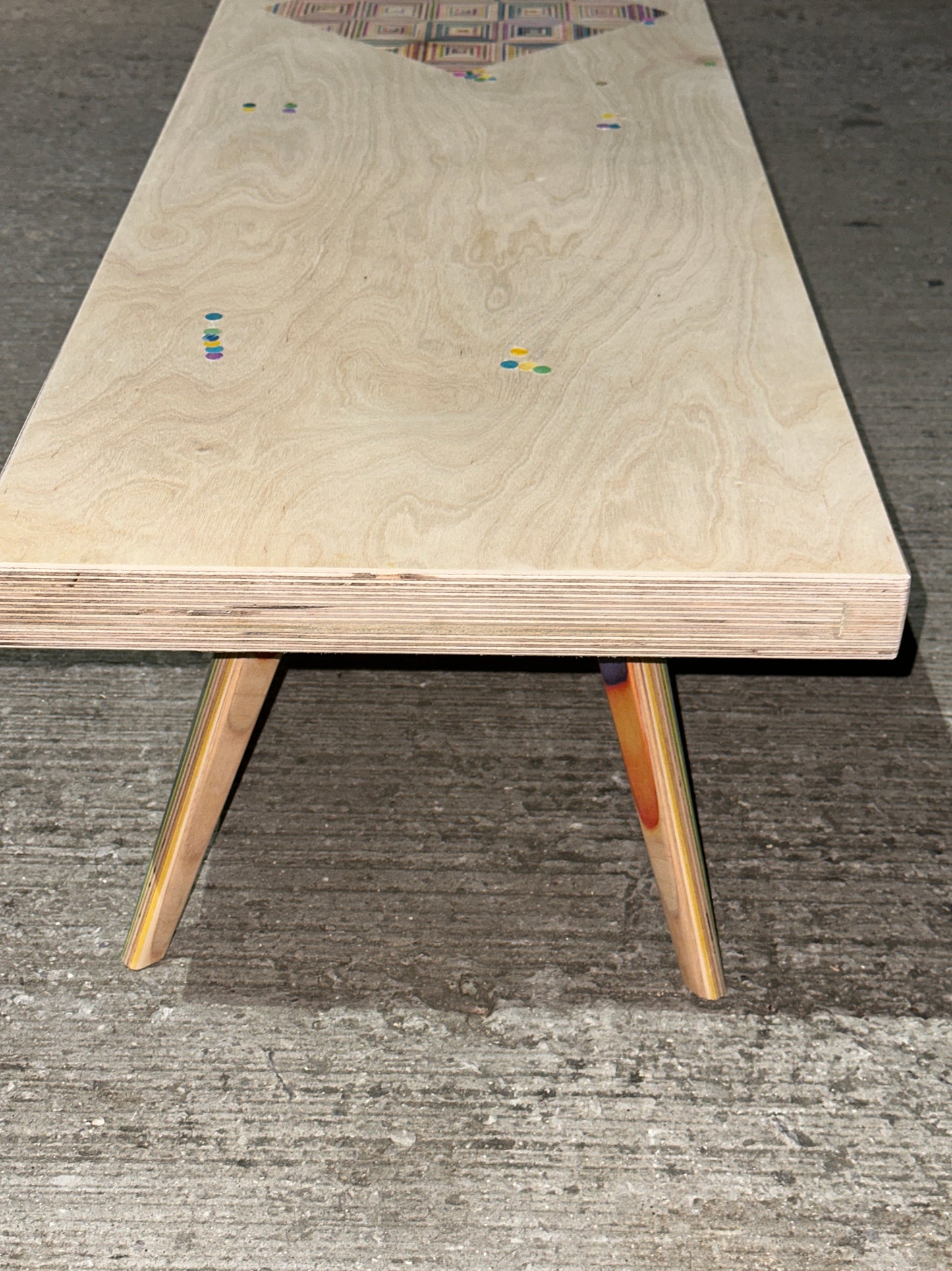 Birch plywood coffee table with geometric skateboard inlay and legs