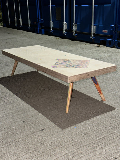 Birch plywood coffee table with geometric skateboard inlay and legs