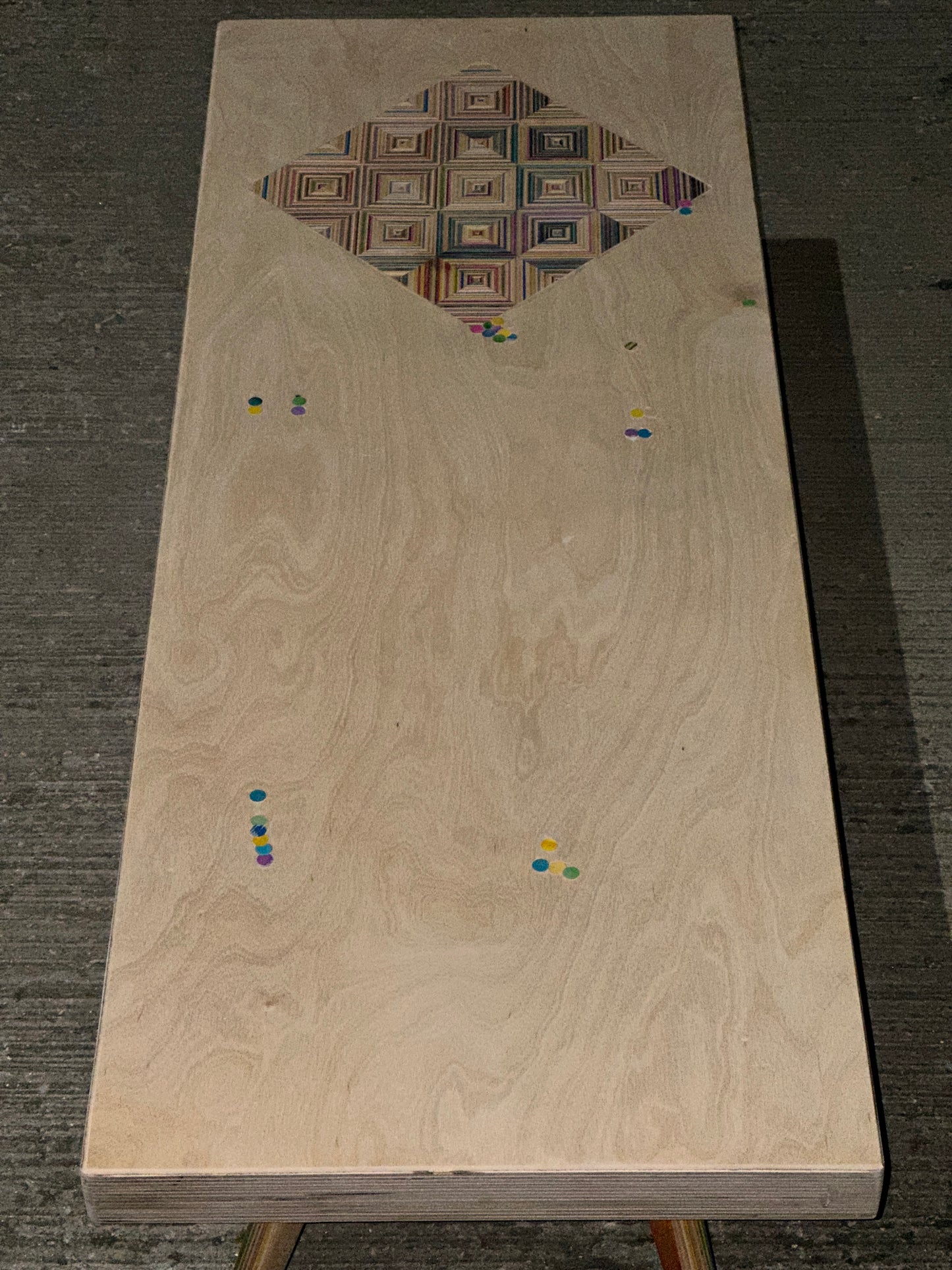 Birch plywood coffee table with geometric skateboard inlay and legs