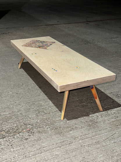 Birch plywood coffee table with geometric skateboard inlay and legs