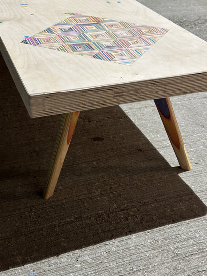 Birch plywood coffee table with geometric skateboard inlay and legs
